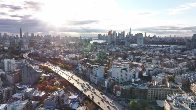 Brooklyn-Queens Expressway traffic passing through Williamsburg, Brooklyn on an autumn afternoon.