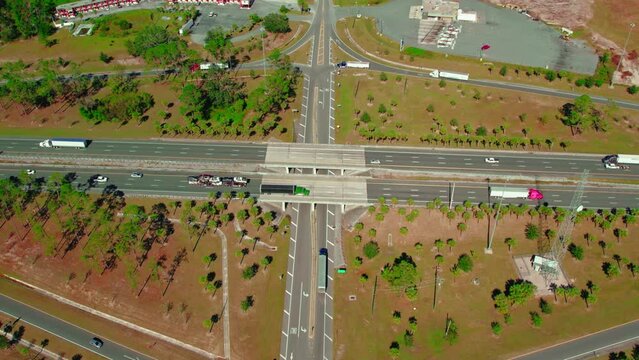 Highway and bridge underpass full of semi trucks and trailers. Truck drivers to shipping and recievieng. Jasper, Florida