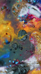 Ink mix background. Glitter dye. Fluid sequins art. Silver grey white red orange blue color shimmering liquid oil paint blend bubbles with gold particles abstract hypnotic swirls.