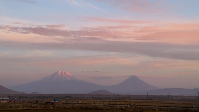 Agri Ararat Mountain Turkey Armenia Iran border snow capped high altitude in twilight pink sky blue clods in horizon after sunset before sunrise natural landscape of beautiful wonderful scenic shot