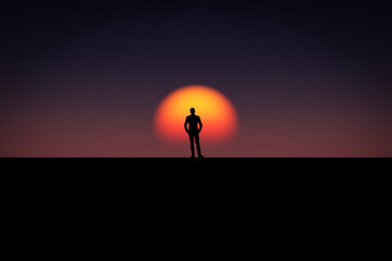 A man stands in an open area and looks at the sunset.