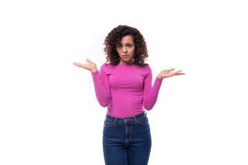 young fashionista curly brunette lady dressed in a fresh lilac color turtleneck on a white background