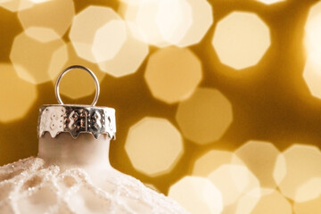 Christmas ball close-up against a background of sparkling garlands