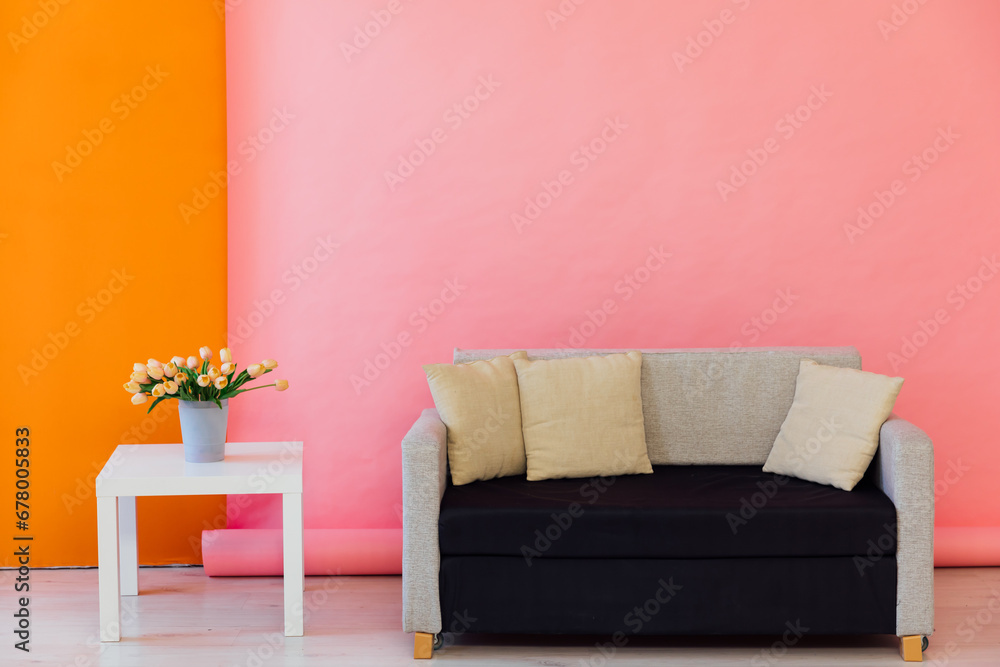 Wall mural Pink orange room interior with grey office sofa and flowers