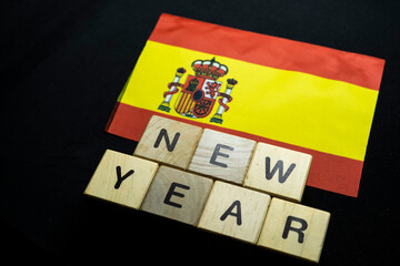 New year to Spain people with Spain flag on banner