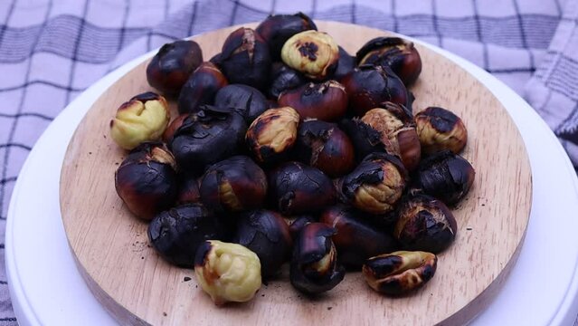 Roasted chestnuts rotating on a turntable. 