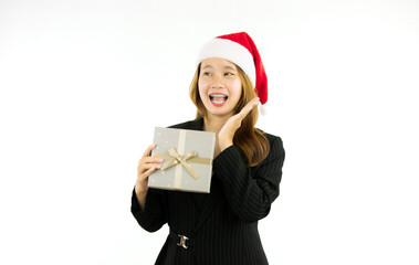 business woman with santa hat holding gift box isolated on white background studio portrait. christmas party concept.