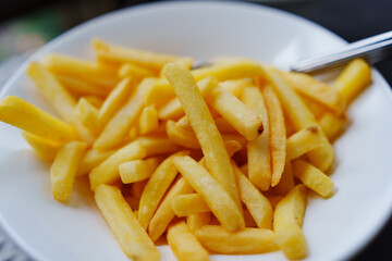 A plate of french fries. favorite fast food food.