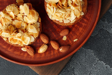 Tart pie with almond petals on plate