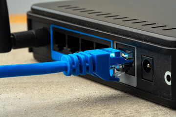 Modern router with cables plugged in close up