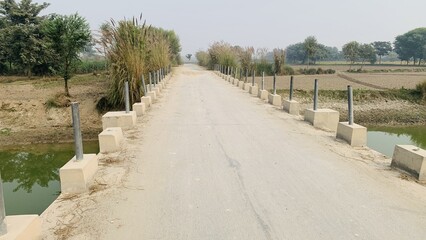 Fototapeta premium Beautiful Way royalty. highway landscape. Beautiful nature scenery to travel on the road. Romantic view image scene. Lake bridge nature landscape. Beautiful nature scenery in the layyah pakistan.