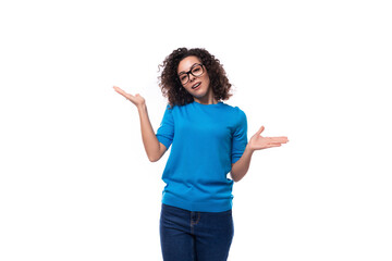 confident successful young caucasian woman with curls dressed in a blue t-shirt