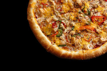 traditional Italian pizza with salami and vegetables on a black