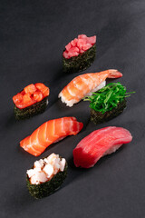 Set of traditional japanese food on a dark background.