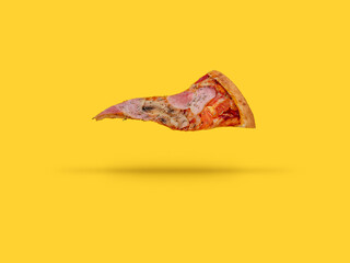 Obraz premium a flying slice of pizza on a yellow background