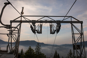 Ropeway in the mountain area in the dreamy misty morning