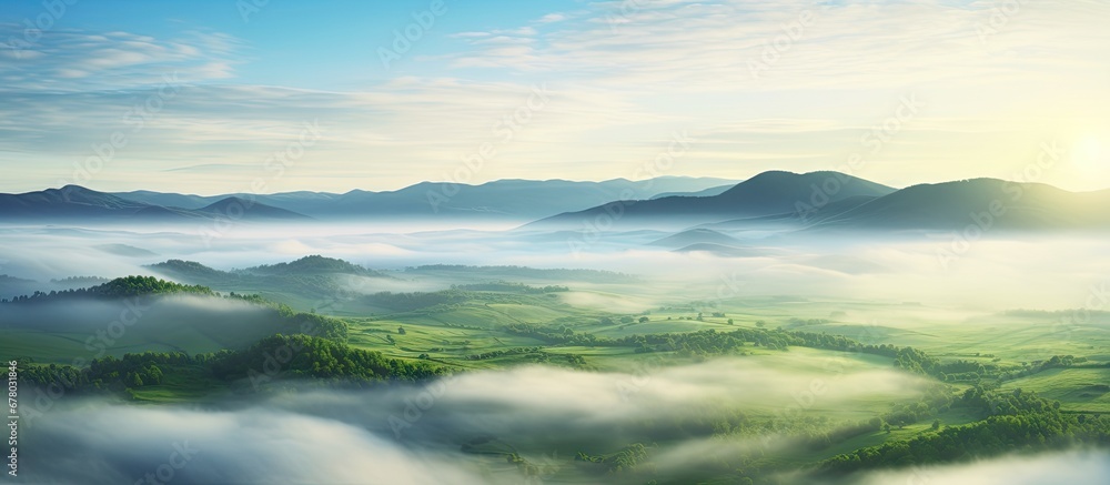 Poster europe s stunning aerial view of a green field at sunrise obscured by enchanting fog copy space imag