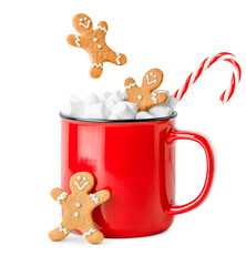 red mug with hot chocolate and marshmallows and gingerbread men falling into it, on a white...