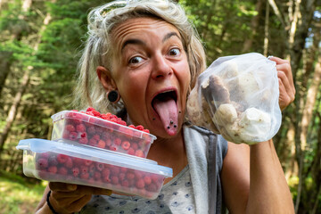 Female mushroom foraging picking mushrooms in Norway  © Mike Workman