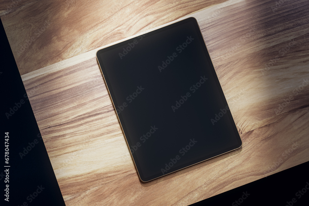 Poster top view of empty black tablet on wooden table. mock up, 3d rendering.