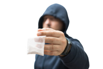 Criminal man in a hood holds transparent plastic bag with white powder hard drugs isolated on...