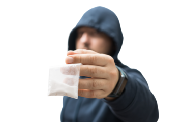 Criminal man in a hood holds transparent plastic bag with white powder hard drugs isolated on transparent background, drug dealer or gangster sells narcotics
