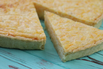 Fototapeta na wymiar Delicious Quiche pie with four cheese filling