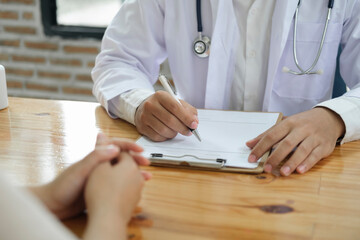 Doctor and patient. Doctor having a checkup with a patient at clinic.