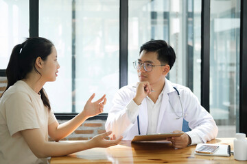 Doctor talking to a patient at medical clinic..