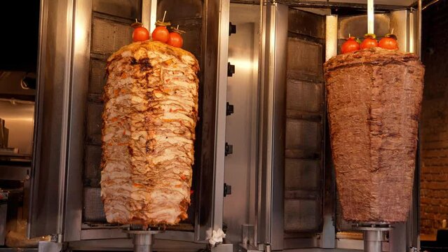 Meat on spit for Shawarma. Meat on grill. Cooking. Doner Traditional Turkish Meat Doner Kebab. Shawarma or gyroscopes. Greek or Middle Eastern Arabic Style Chicken Doner Kebab Food