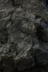 Black white rock texture. Mountain surface. Close-up. Gray stone background with copy space for design. Wide banner. Panoramic.