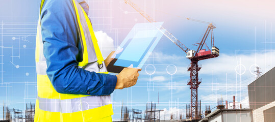 Engineers work on construction drawings and safety systems.,Building construction puts safety first.