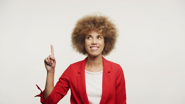 Woman Pointing Up At Copy Space on White Background