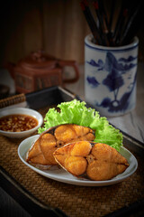 traditional chinese steamed seafood fresh cod fish with soya sauce in plate on grey vintage background asian cafe hotel luxury halal food restaurant banquet menu