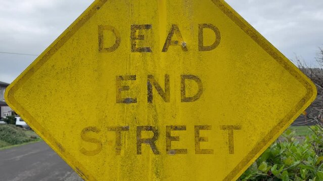 Close Up - Weathered Dead End Signpost.