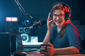 Smiling DJ hosting a radio show