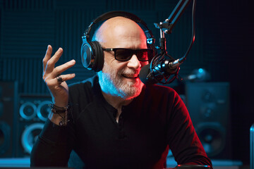 Radio presenter talking into the microphone