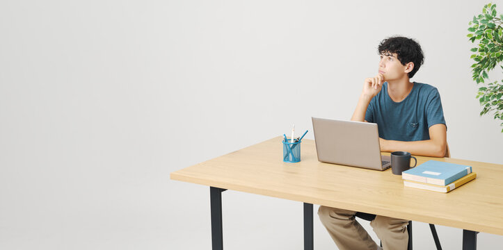 Confident Student Thinking With Hand On Chin