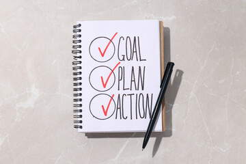 The plan of goals is written in a notebook
