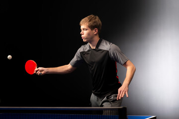 Portrait of young man playing tennis