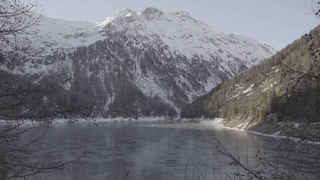 Frozen lake with mountains background (4k slog)