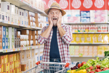Cheerful excited farmer doing grocery shopping