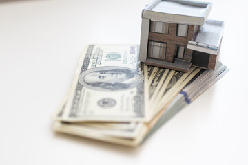 Naklejka premium Volumetric project of house. Layout of a house with an open roof. Miniature layout of a cottage top view. Building model as a symbol of architectural business. Design in architectural bureau