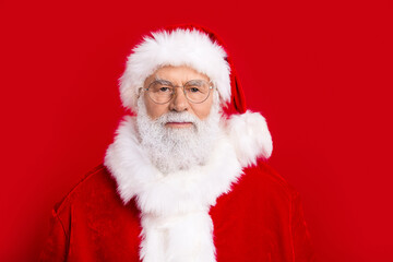 Photo of old fairy character santa in traditional costume magic christmas isolated on red color background