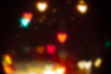 blurred heart shaped bokeh night light .Defocused light background .