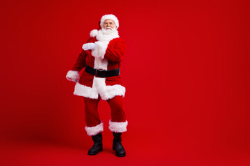 Full length photo of positive santa claus fairy character dancing magic miracle time season empty space isolated on red color background