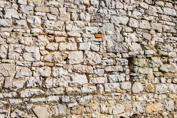Stone wall. Masonry of stones. Vintage background. Old stone wall texture. Drystone wall. Antique natural stonewall