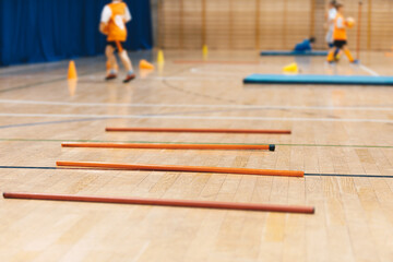 Futsal training field with orange poles yellow cones and red hurdles. Physical education. Futsal...