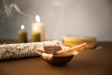 Palo santo burning stick with white sage and tarot deck
