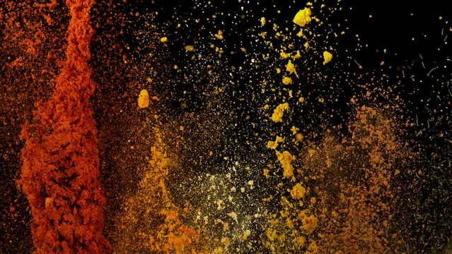Super Slow Motion Shot of Colorful Explosion of Various Spices on Black Background at 1000fps.